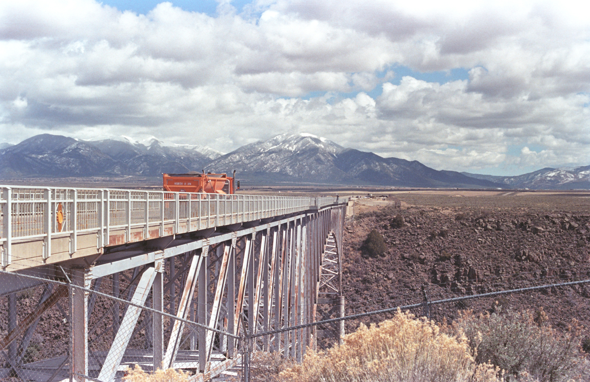 A photo of a truck traveling across the Rio Grande Bridge just west of Taos, NM.